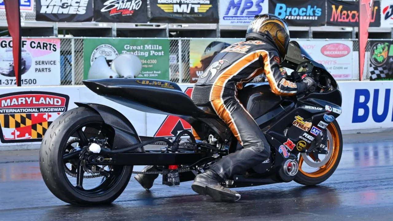 How does a gear shifter work in motorcycle drag racing?